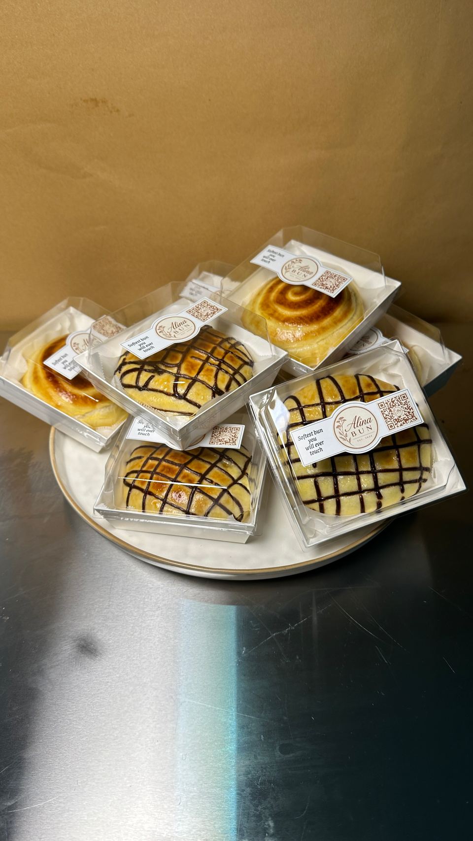 Boxed chocolate and cream buns on a plate