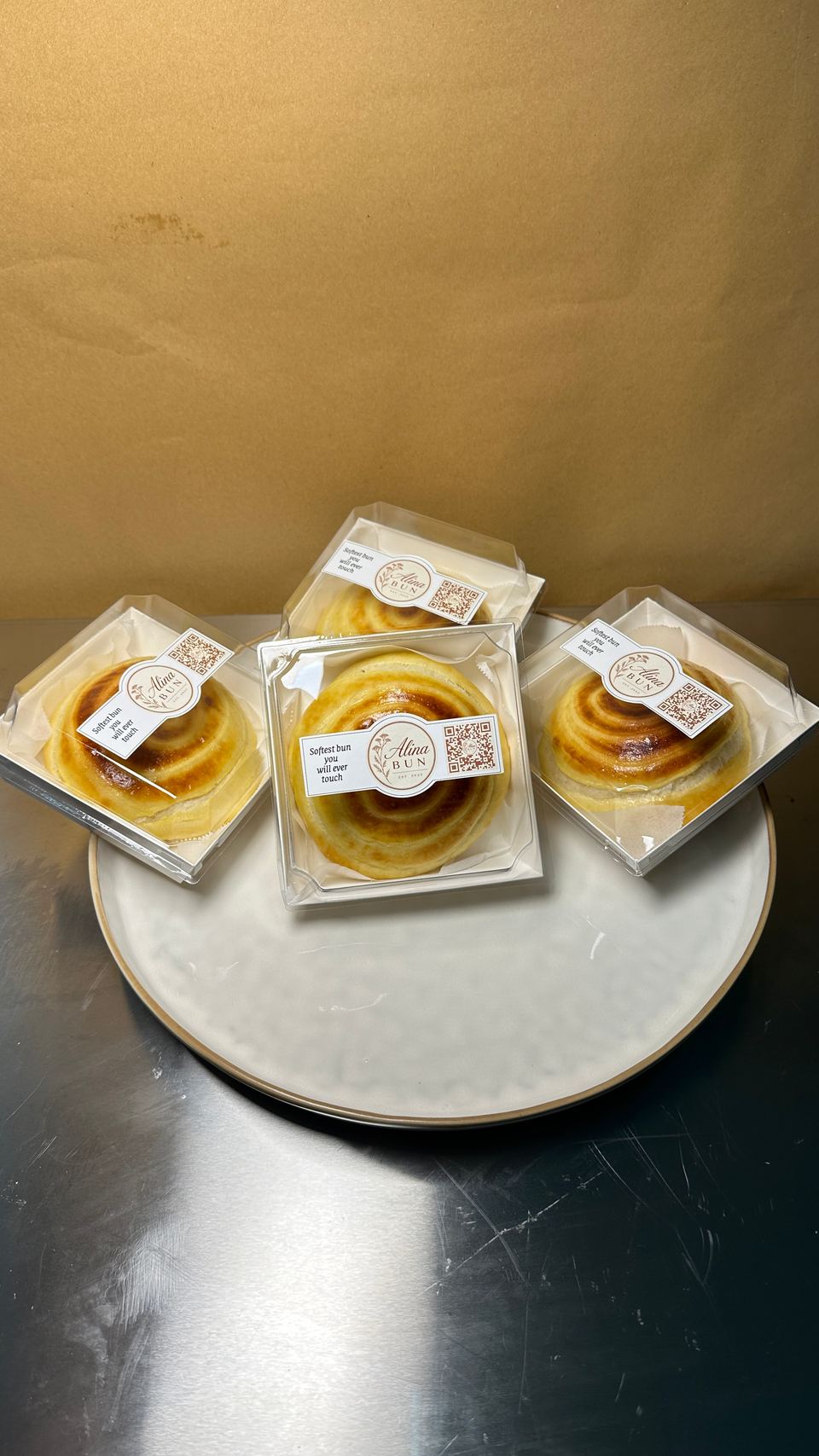 Three boxed buns on a plate