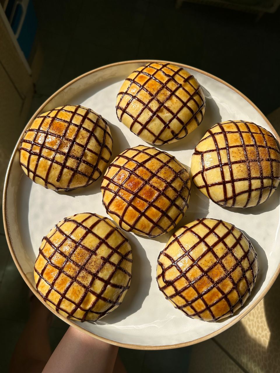 Chocolate lattice buns on a plate