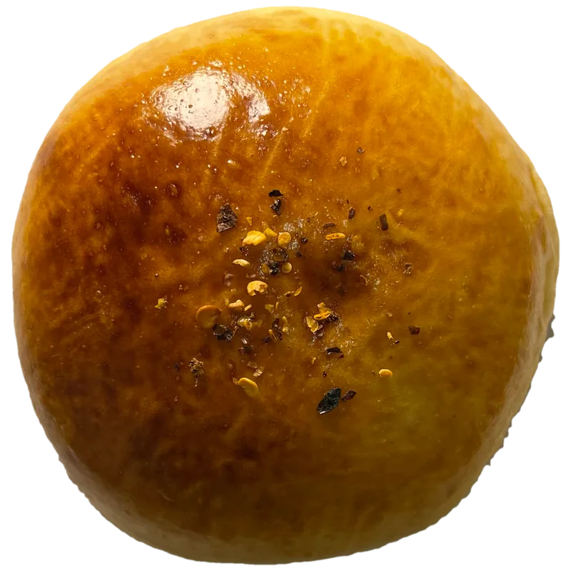 A golden tuna bun, flecked with chilli